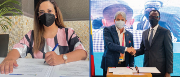 A la izquierda la directora de APC-Colombia, Viviana Manrique Zuluaga firmando, a la derecha el embajador de Colombia en Emiratos Árabes Unidos, Jaime Amín Hernández y Emmanuel Hategeka, embajador de Ruanda en Emiratos árabes Unidos de la mano